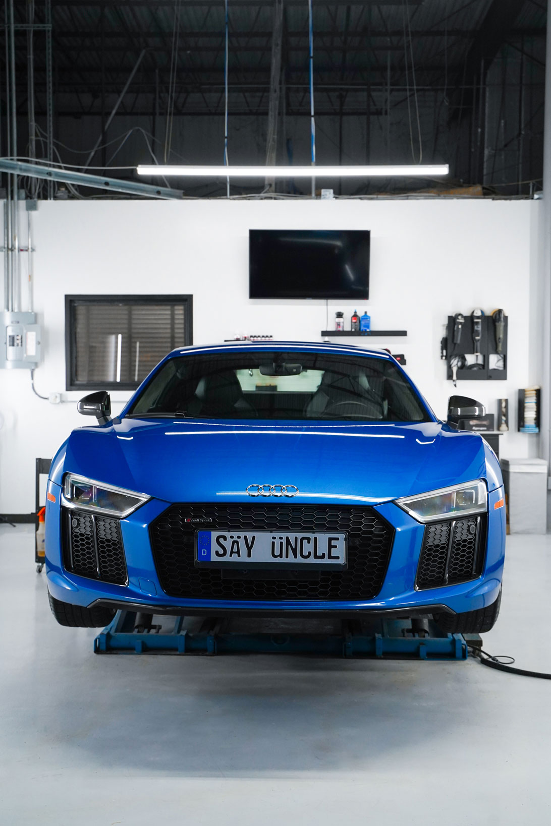 blue audi being worked on by forza