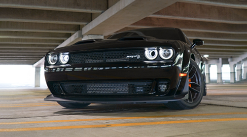 black Forza Dodge challenger in garage